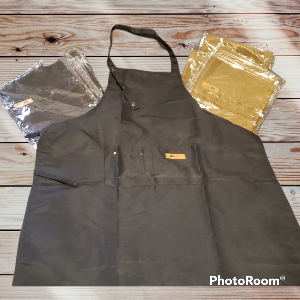 BNIP Brown or Blk Aprons still in plastic pkg wrap w/barcodes